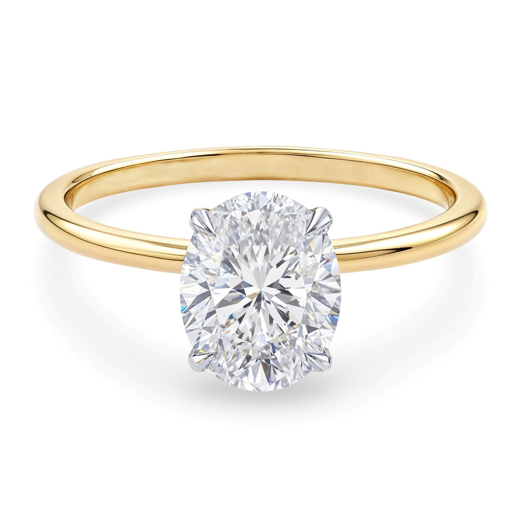 1 1/2 carat oval lab-grown diamond solitaire ring in elegant 10K yellow gold, showcasing timeless luxury and sophistication.