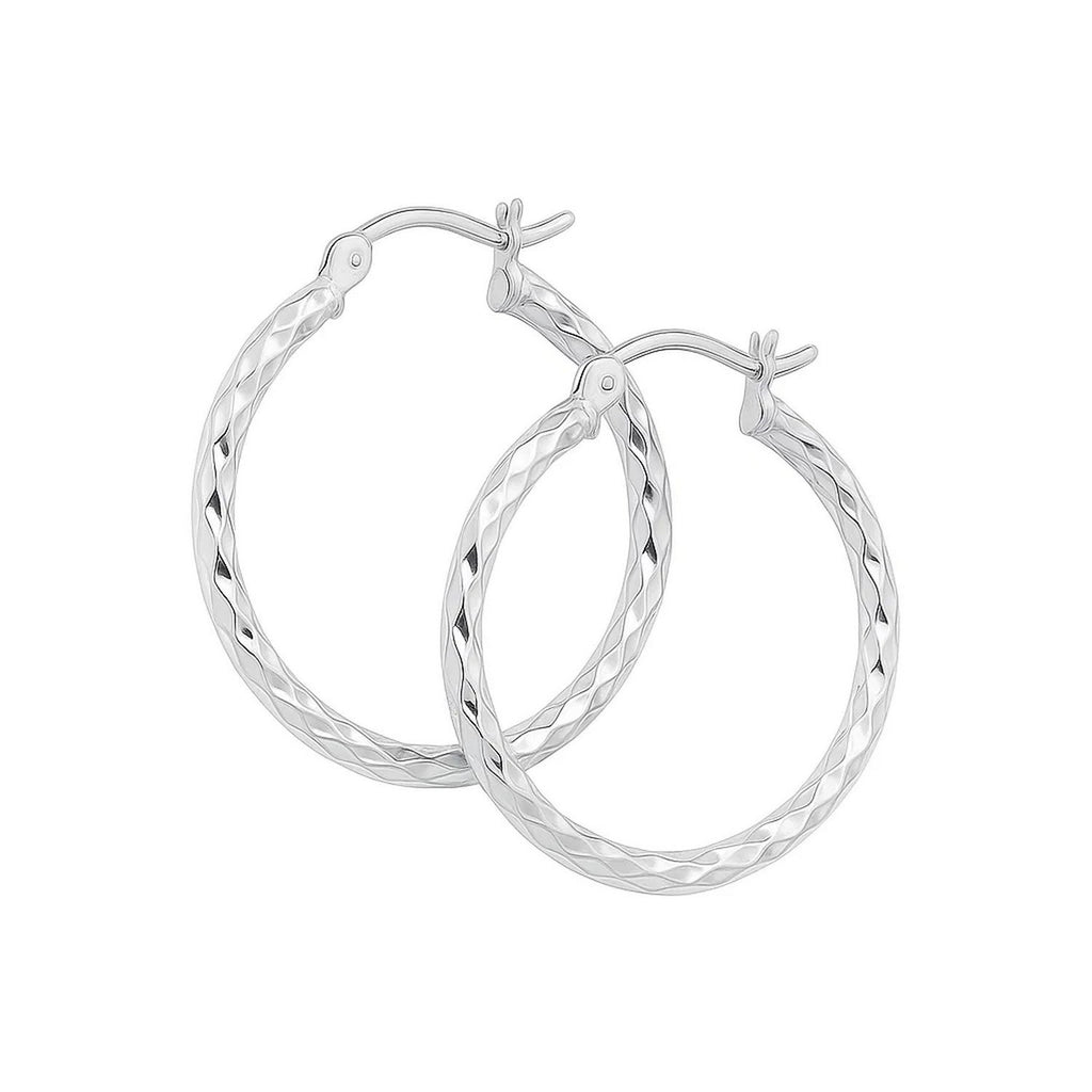 14k white gold diamond cut hoop earrings showcasing a modern design with exquisite craftsmanship and shimmering brilliance.