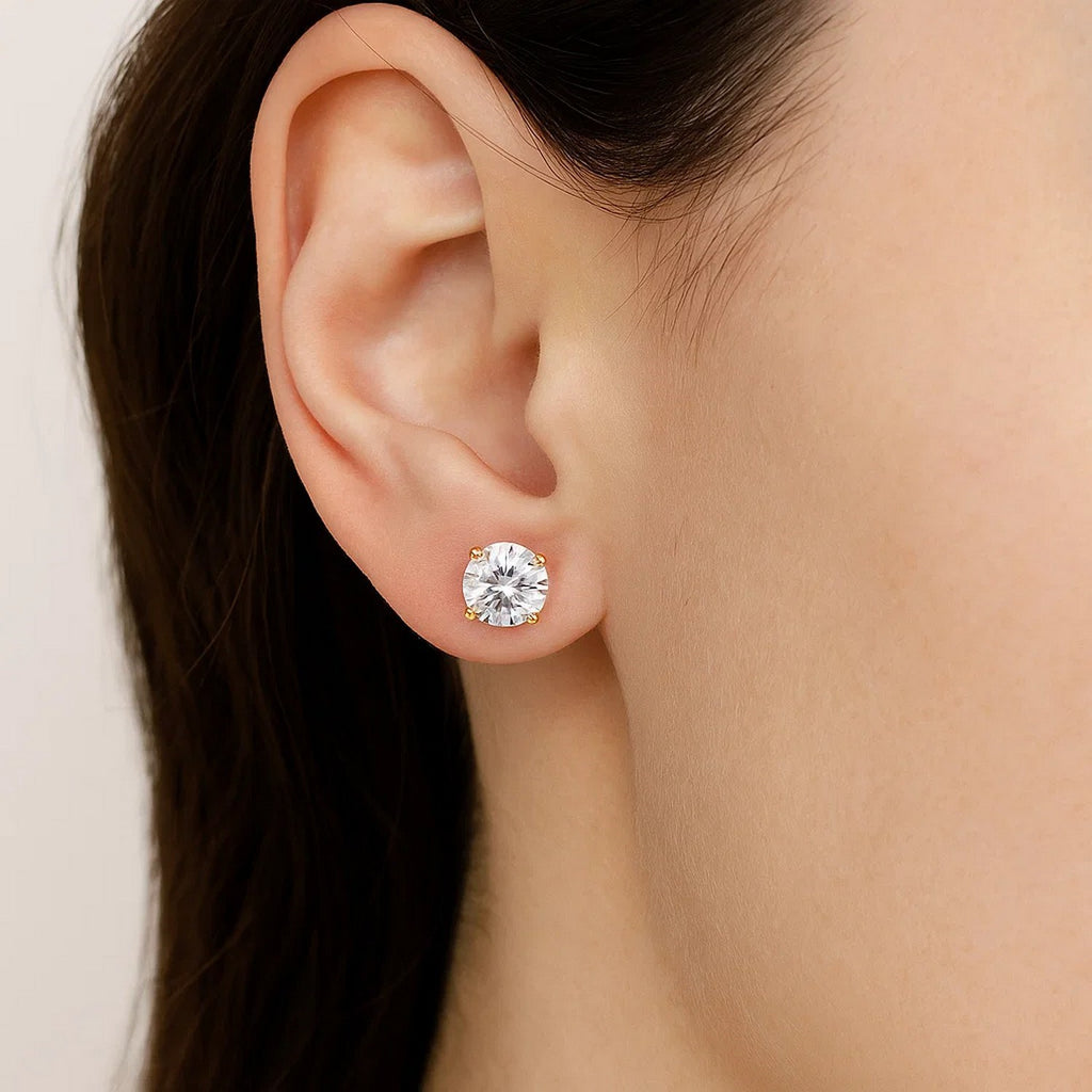 14k yellow gold stud earrings featuring faceted cubic zirconia for a modern, elegant look.