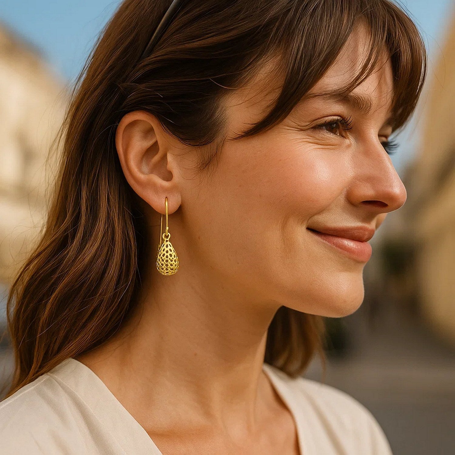 14k yellow gold honeycomb textured teardrop earrings with contemporary drop design, perfect for elegant occasions.
