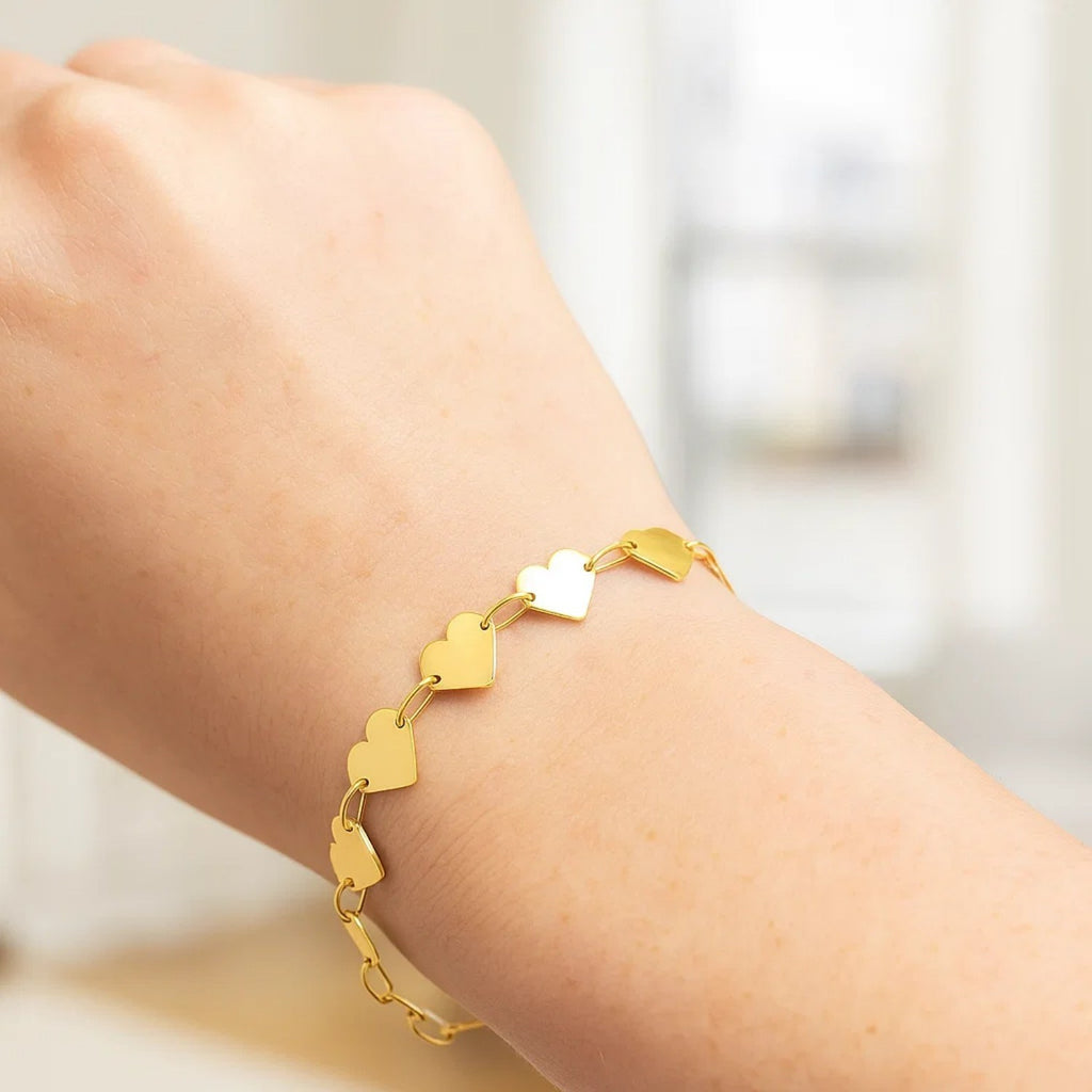 Elegant 10K yellow gold chain bracelet featuring a mirror heart design, perfect for luxury jewelry enthusiasts.