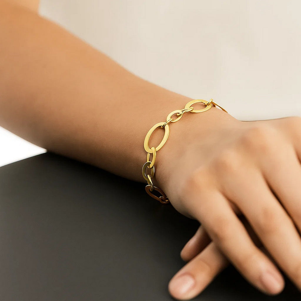 Large flat oval link bracelet in elegant 14k yellow gold, showcasing a refined design perfect for luxury occasions.