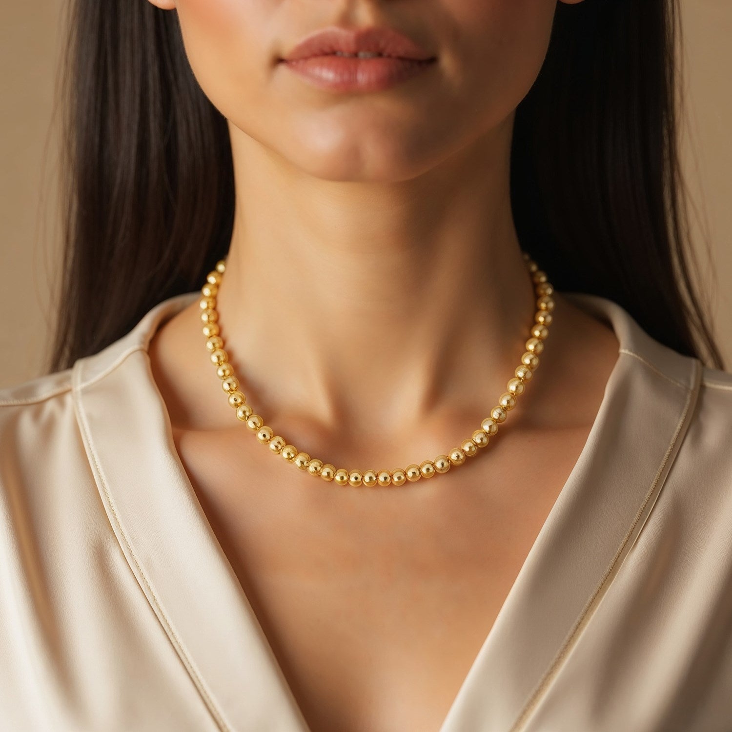 Elegant 14k yellow gold bead chain necklace featuring 4mm round beads, perfect for layering or standalone wear.
