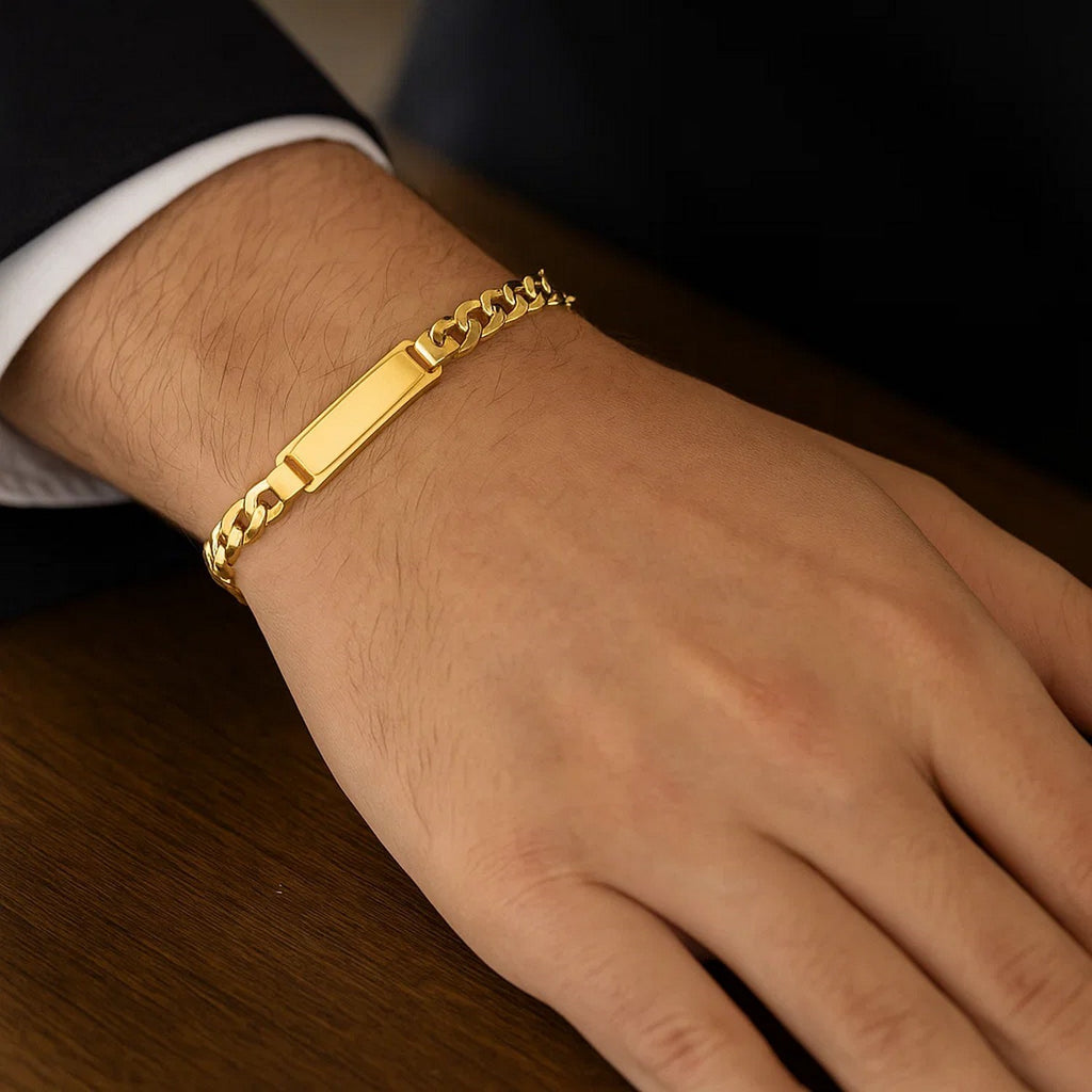 14k yellow gold men's ID Cuban chain bracelet with modern link design, showcasing luxurious craftsmanship and style.
