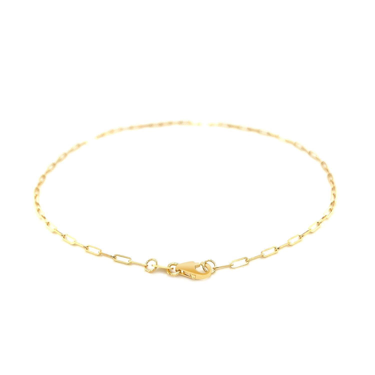 Elegant 14k yellow gold fine paperclip anklet featuring a delicate chain design, perfect for layering or solo wear.