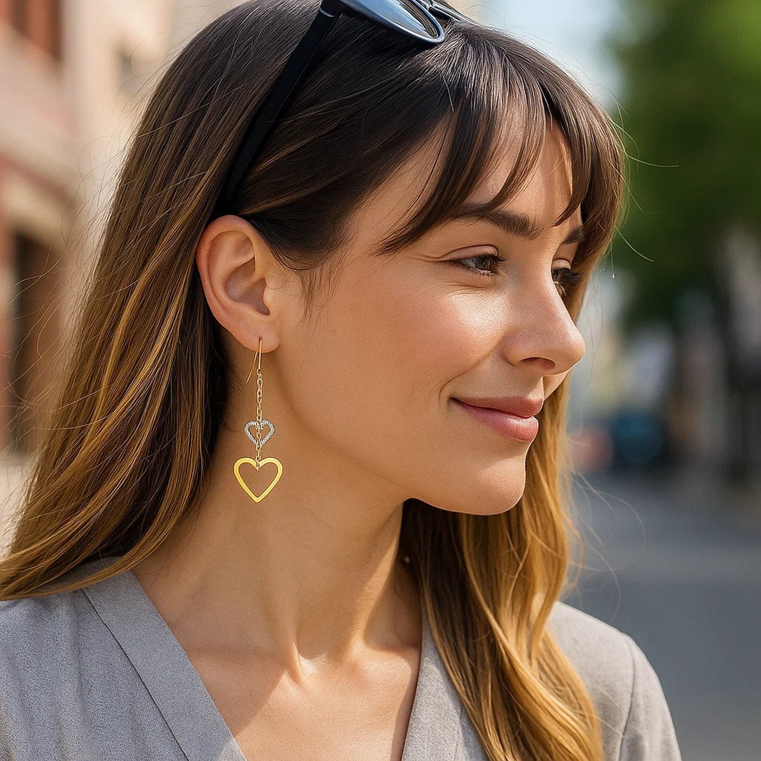 14k two-tone gold dangle heart earrings featuring an elegant design and exquisite craftsmanship.