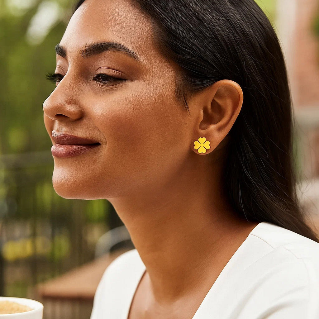 Elegant 14k yellow gold four leaf clover stud earrings, showcasing a timeless design with a luxurious finish.