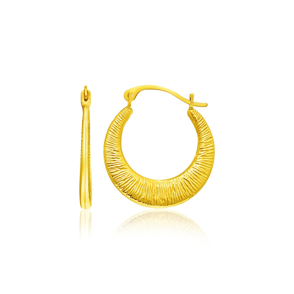 14k yellow gold textured hoop earrings, elegantly designed for a luxurious touch to any outfit.