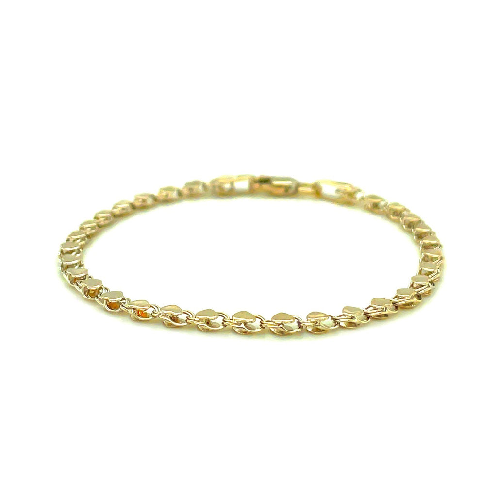 Elegant 2.9mm 14k yellow gold heart anklet featuring a delicate chain design for a luxurious touch.
