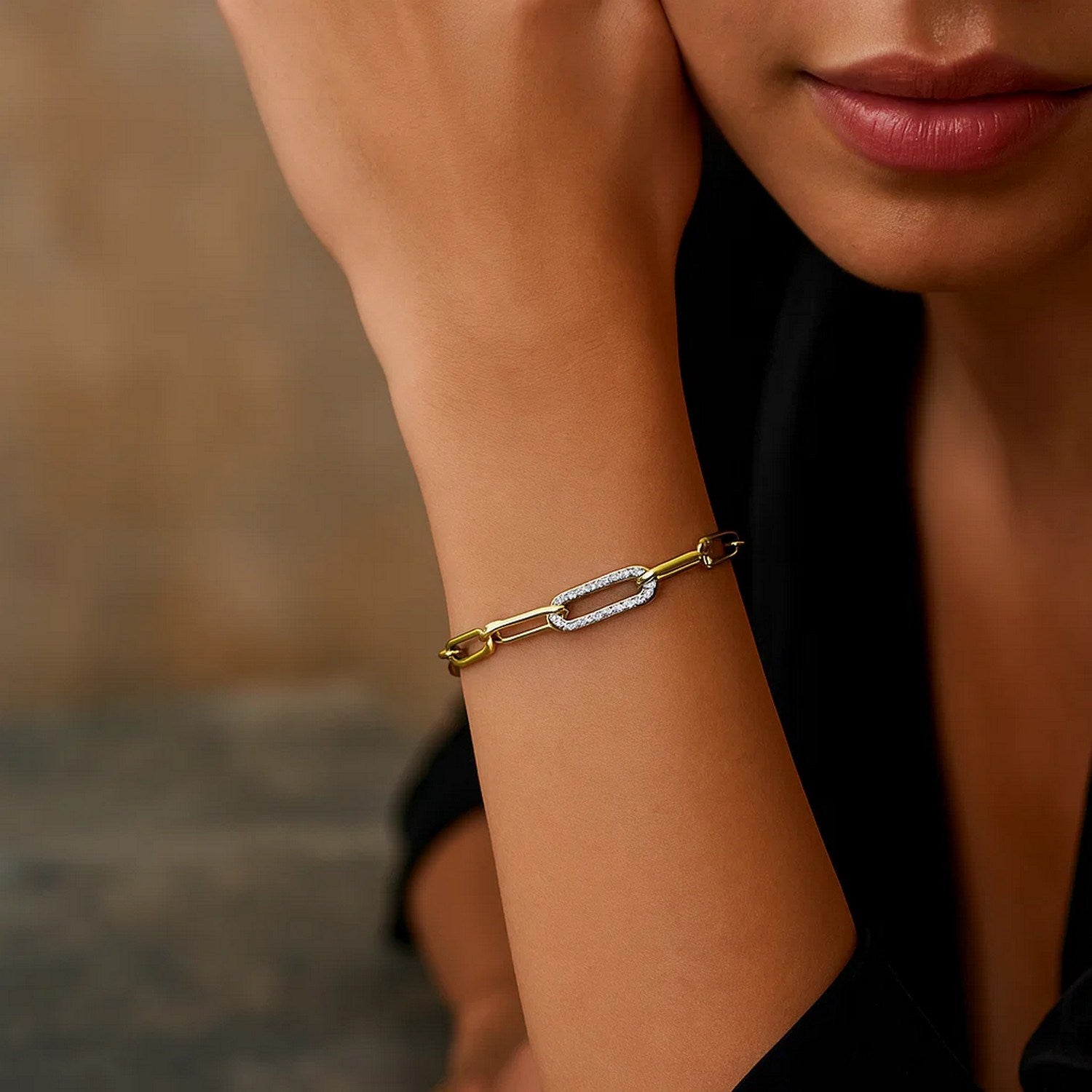 14k yellow gold paperclip chain bracelet featuring a modern diamond link design, perfect for elegant layering.