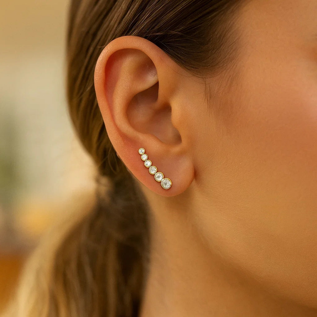 14k yellow gold graduated circles climber earrings adorned with sparkling cubic zirconias for a modern luxury look