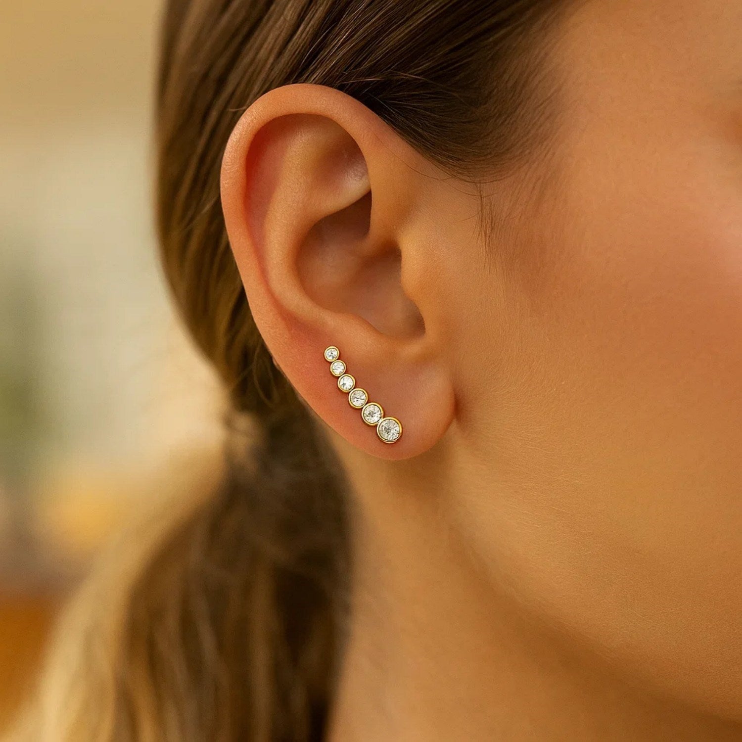 14k yellow gold graduated circles climber earrings adorned with sparkling cubic zirconias for a modern luxury look