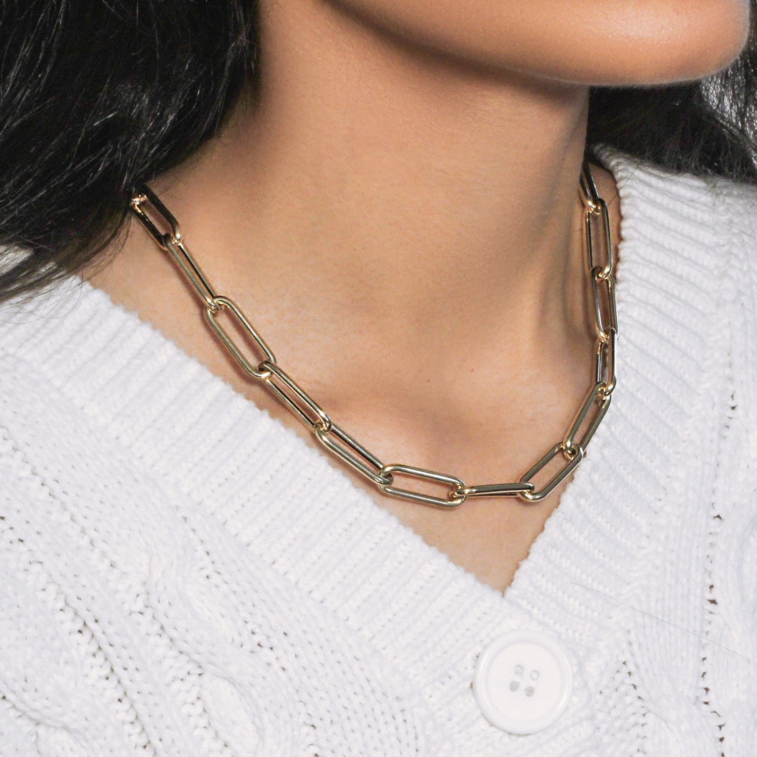 14k yellow gold rounded paperclip chain necklace with modern design and elegant stud accents.