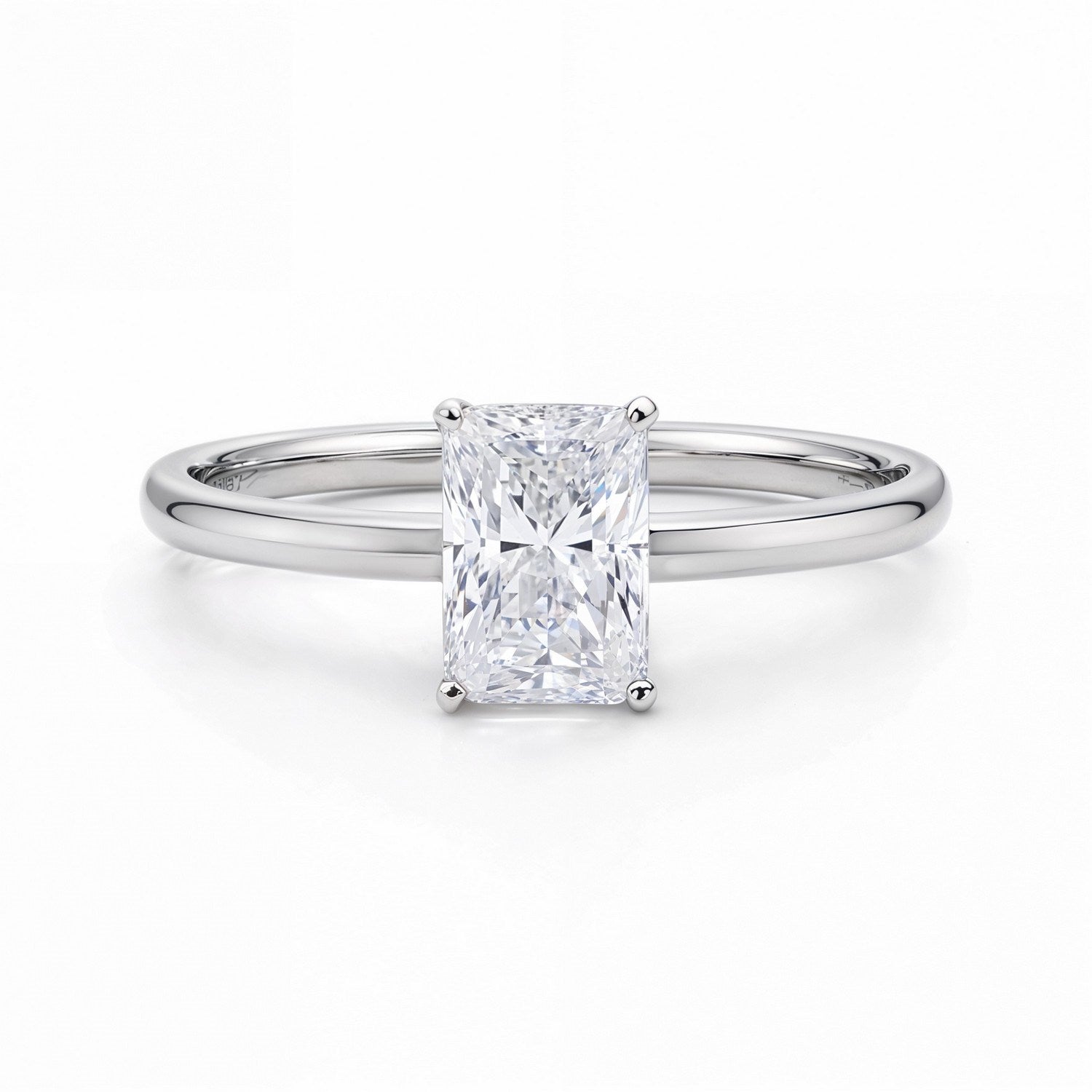 Elegant 1 carat radiant diamond solitaire ring in 14k white gold, showcasing timeless luxury and exquisite craftsmanship.