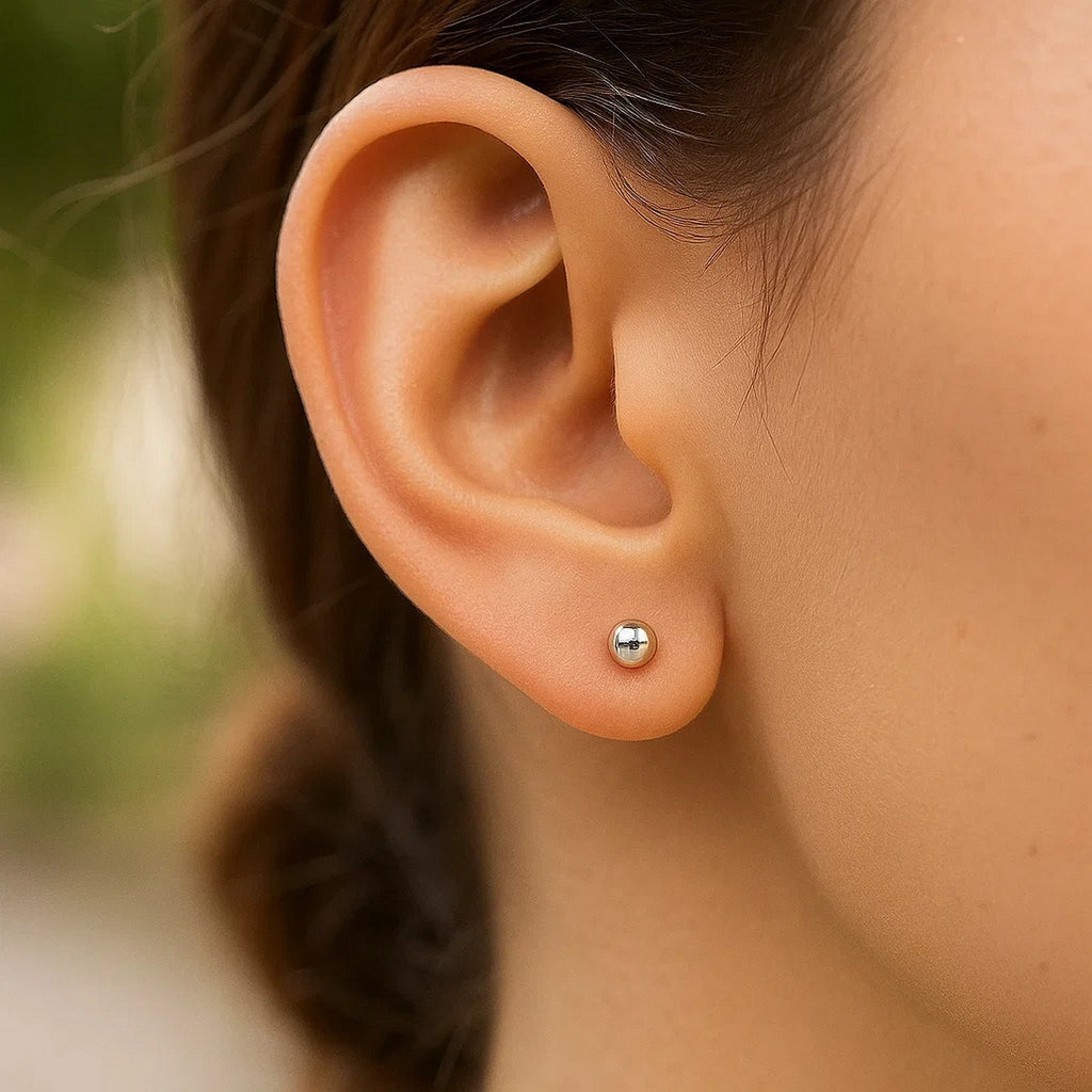 14k white gold spherical stud earrings, modern design with a sleek 3mm profile, perfect for elegant everyday wear.