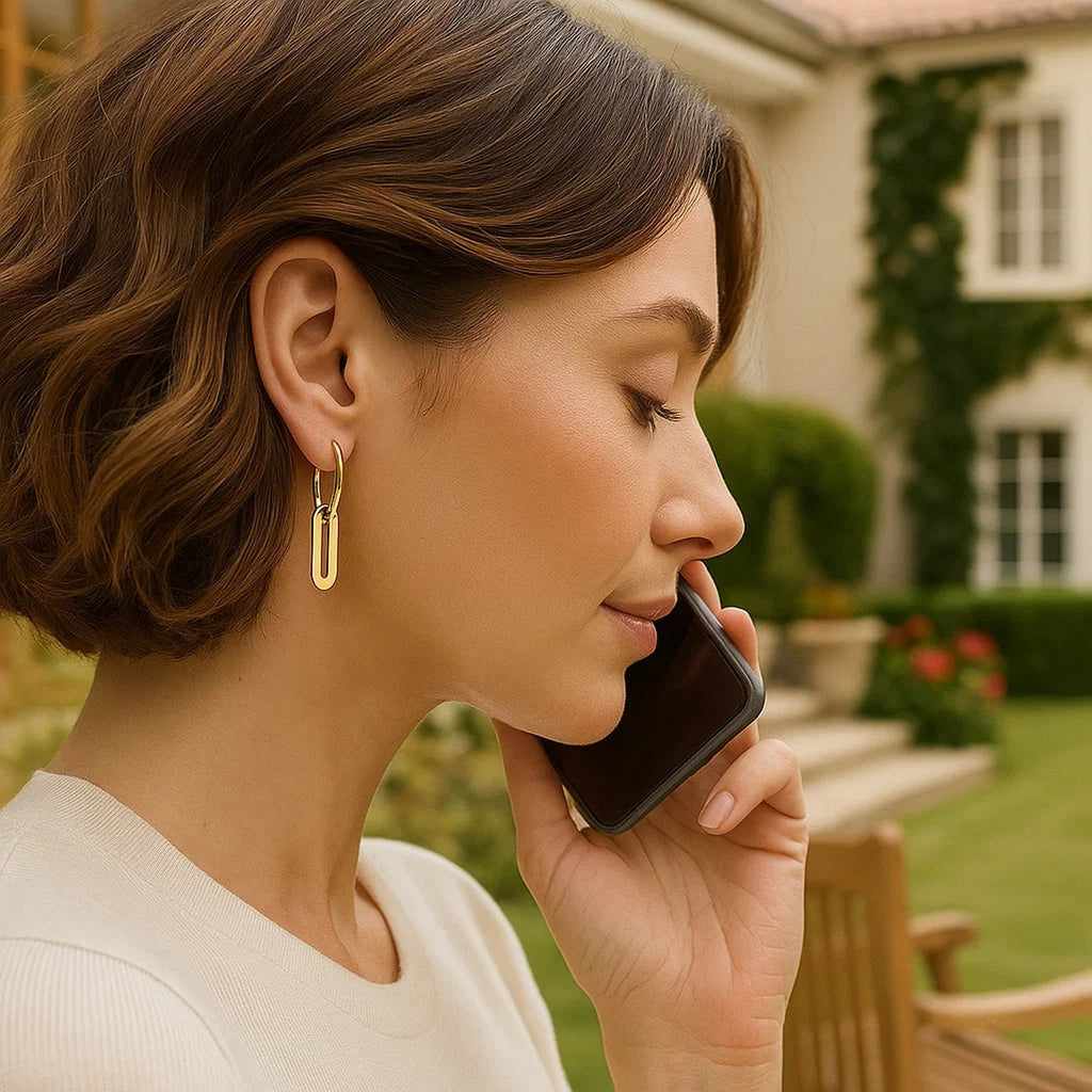 14k yellow gold huggie hoop earrings featuring elegant paperclip link drops for a modern, sophisticated look.