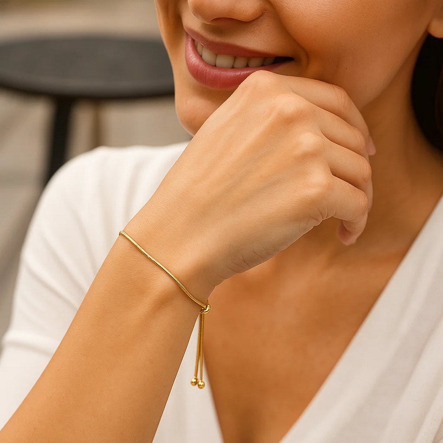 14k yellow gold adjustable lariat bracelet featuring a modern heart motif and delicate chain design.