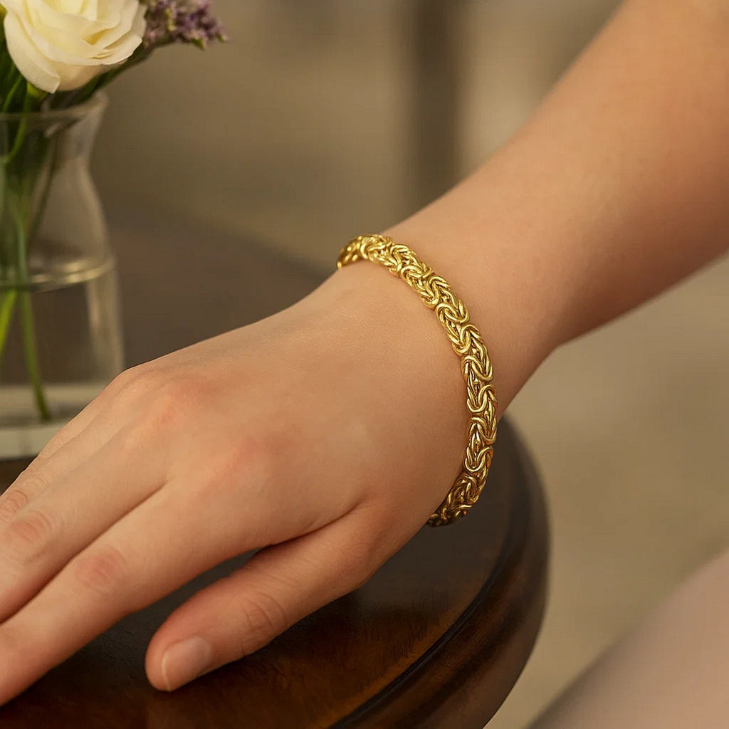 Elegant 10k yellow gold Byzantine design chain bracelet featuring intricate links and a luxurious finish.