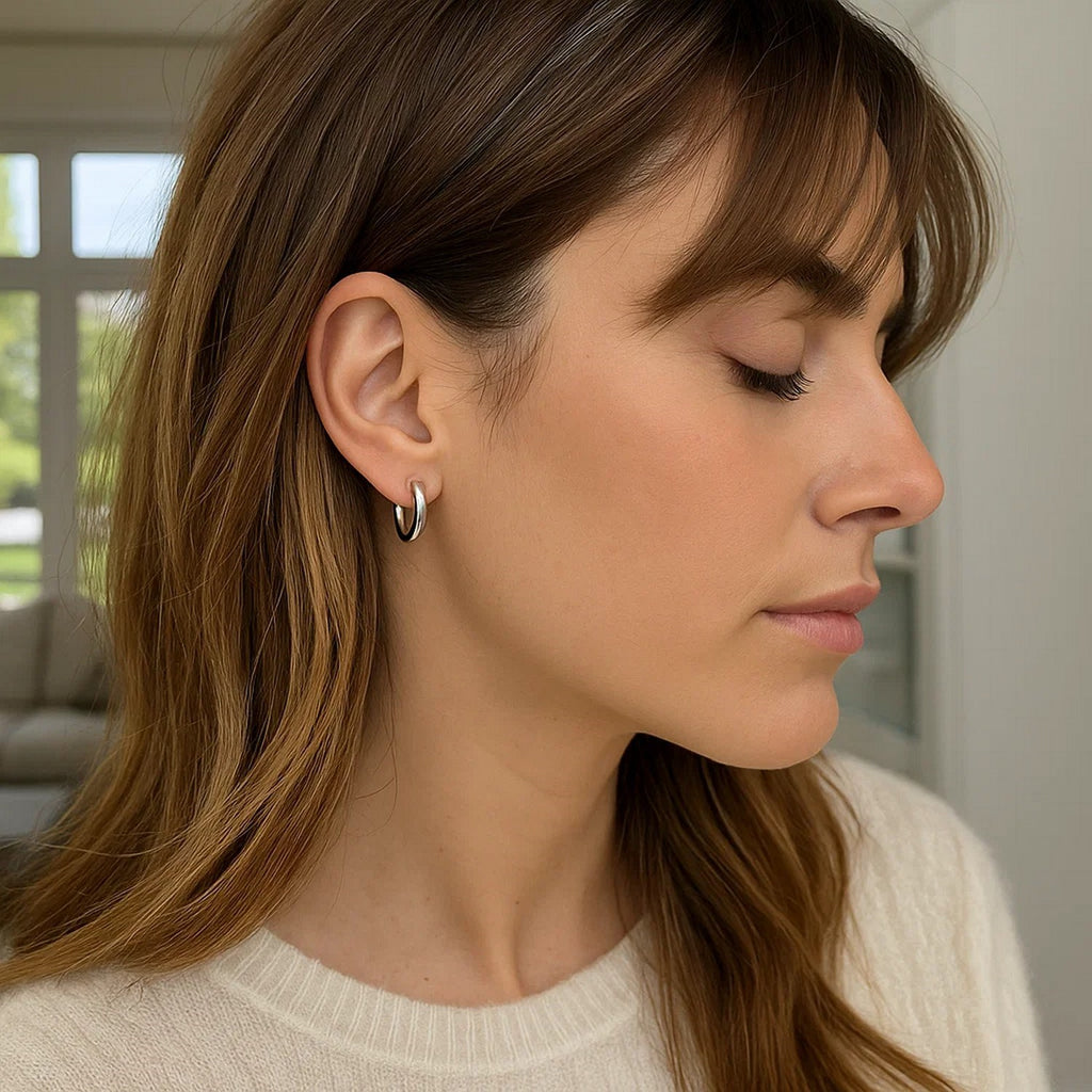 14k white gold polished hoop earrings with a sleek modern design, perfect for elegant everyday wear.