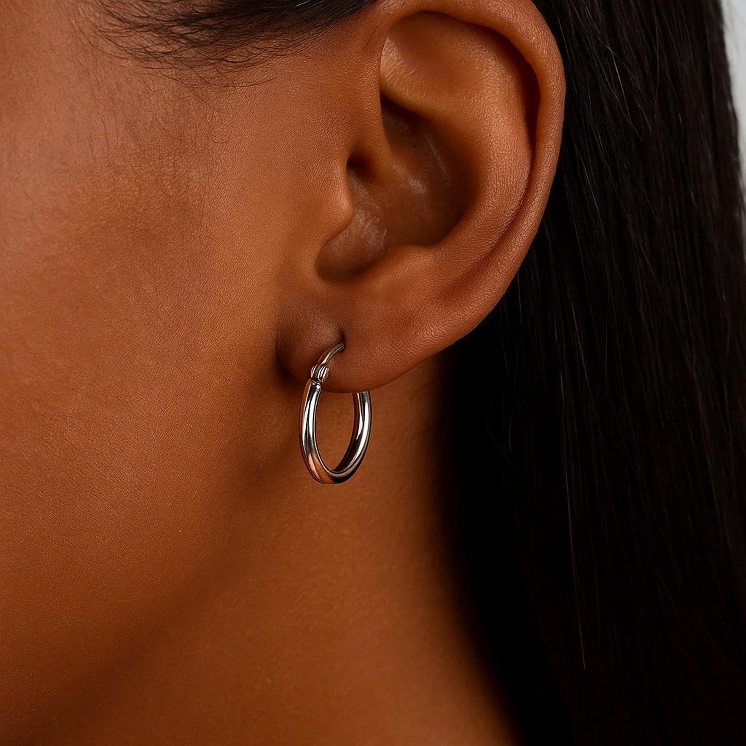 14k white gold polished hoop earrings with a sleek modern design, perfect for elegant everyday wear.