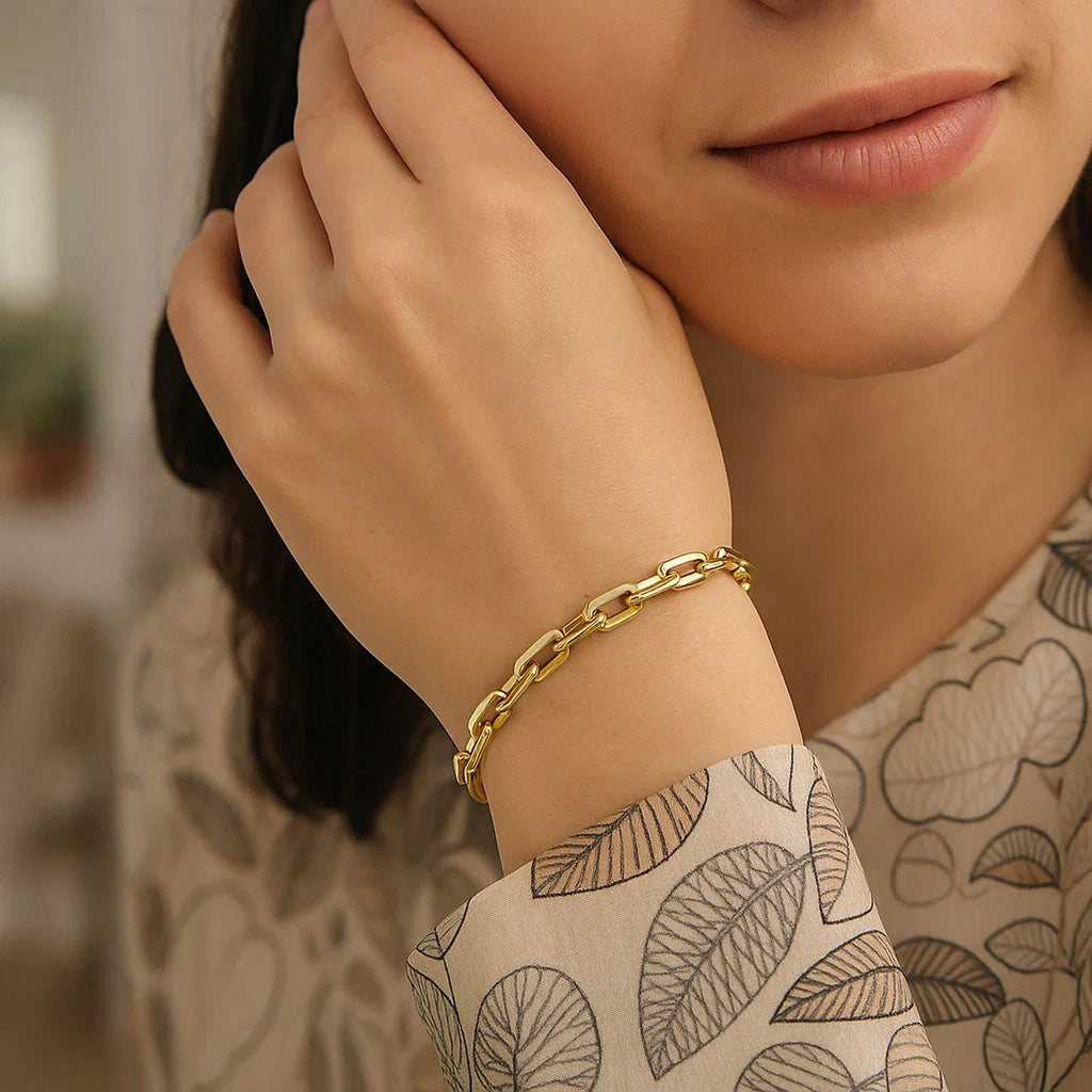 14k yellow gold modern paperclip chain bracelet, 7 1/2 inches, featuring elegant link design and luxurious shine.