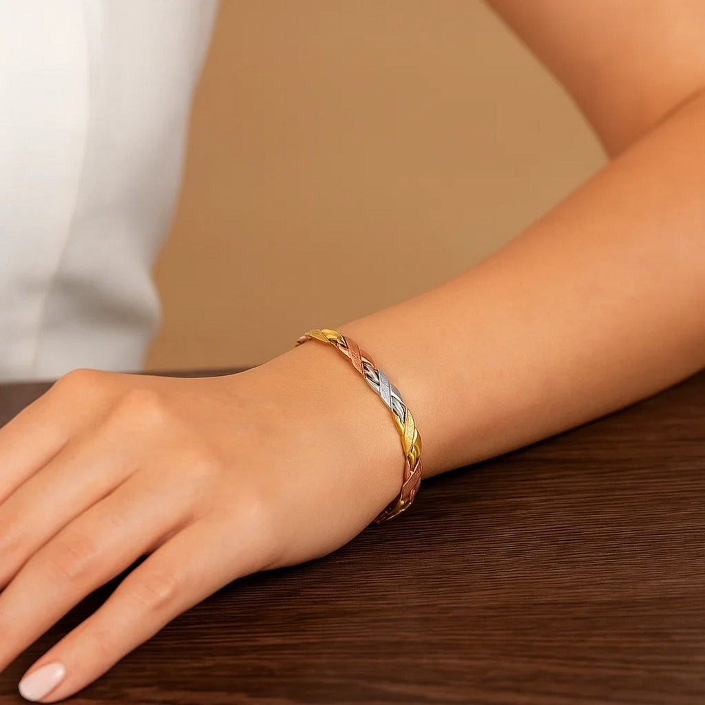 14k tri-color gold bracelet featuring shiny and textured links, exuding elegance and luxury in every detail.