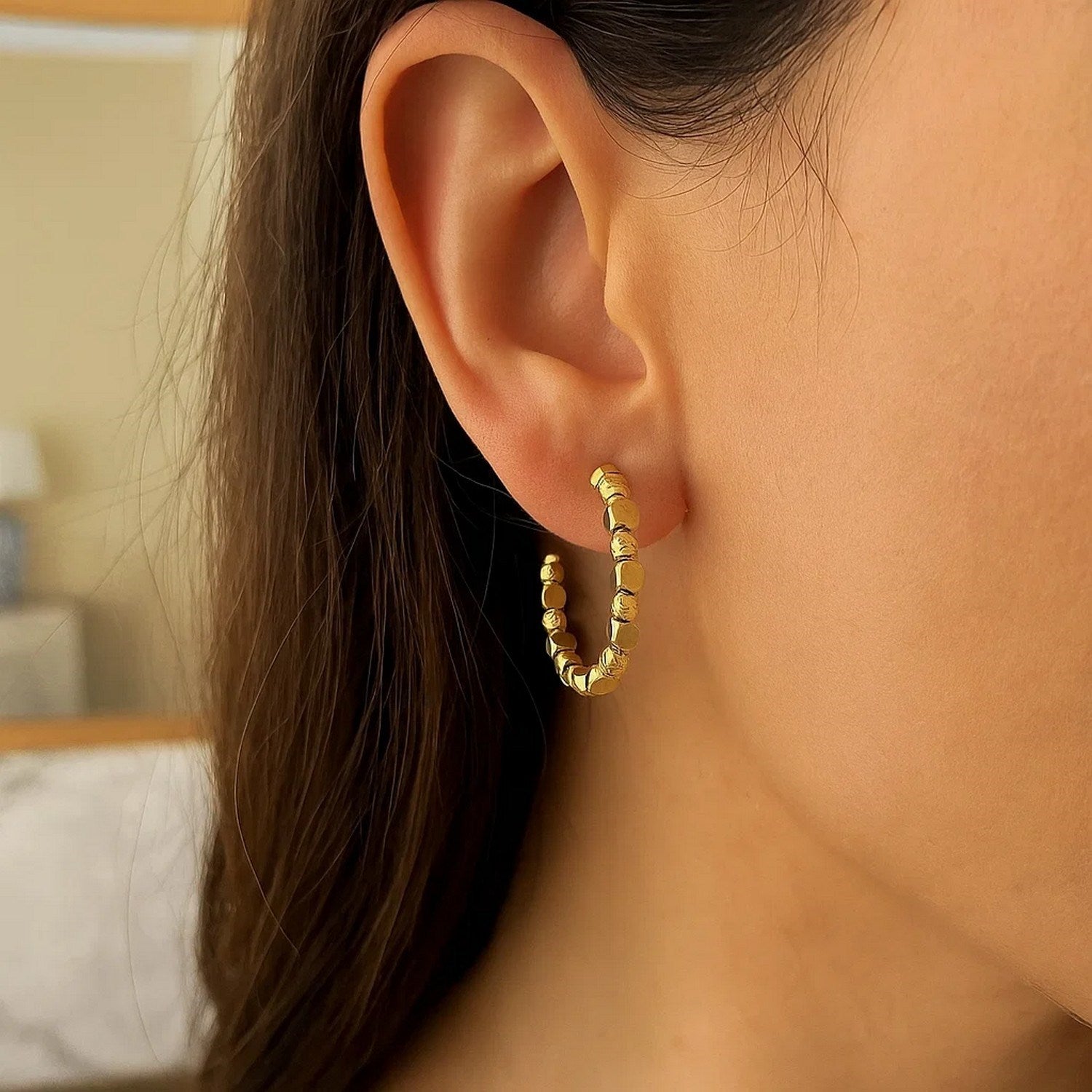 Elegant 14K yellow gold diamond pebble C hoop earrings showcasing a refined design and luxurious sparkle.