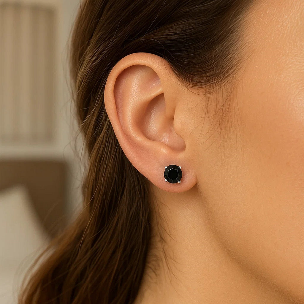 14k white gold stud earrings featuring faceted black cubic zirconia for a timeless, elegant look.