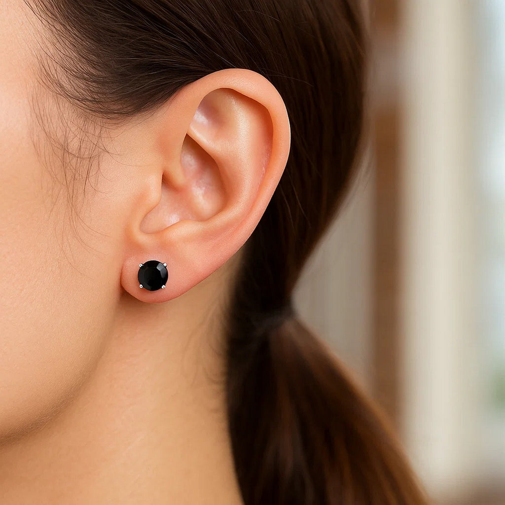 14k white gold stud earrings featuring faceted black cubic zirconia for a classic, elegant look.