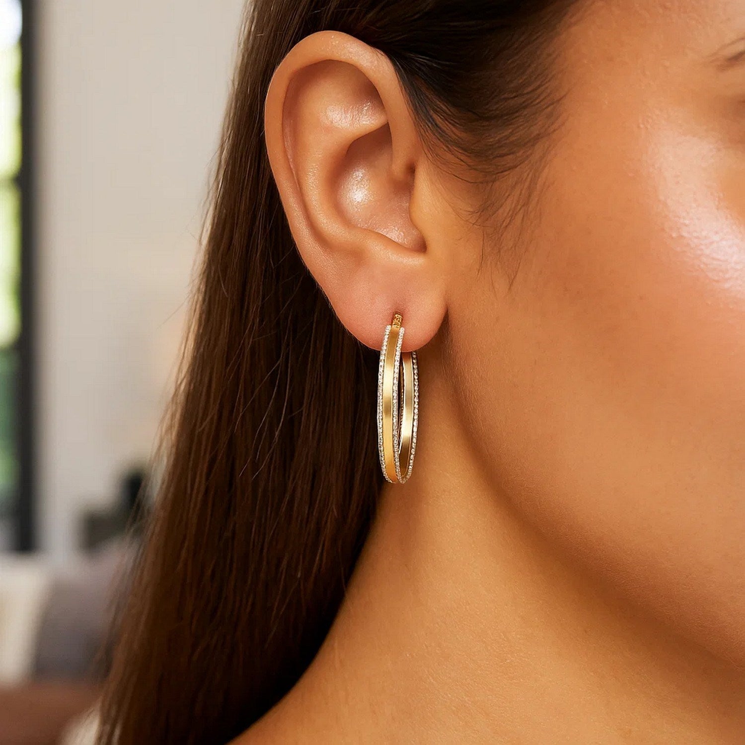 14K two-tone gold diamond cut hoop earrings showcasing a contemporary design with exquisite craftsmanship.