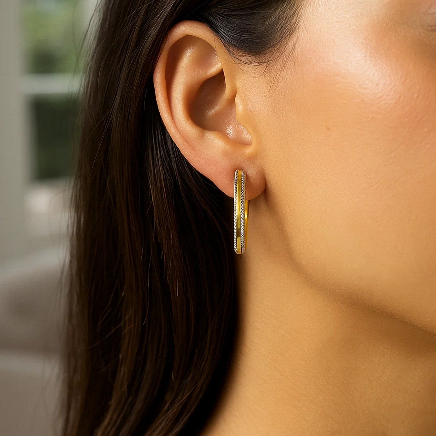 14k two-tone gold diamond cut hoop earrings with a contemporary design, showcasing exquisite craftsmanship and elegance.