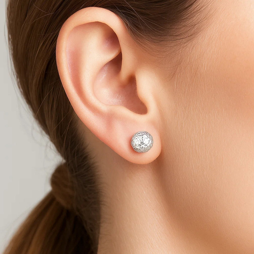 14k white gold textured ball stud earrings showcasing an elegant design for a refined look.