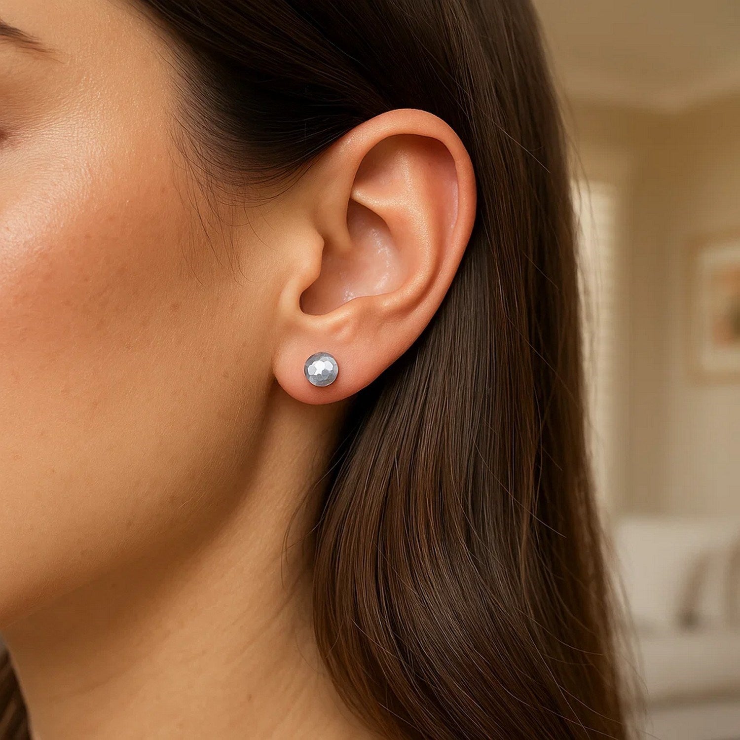 Contemporary 14k white gold faceted ball stud earrings showcasing a sleek, modern design for elegant style.