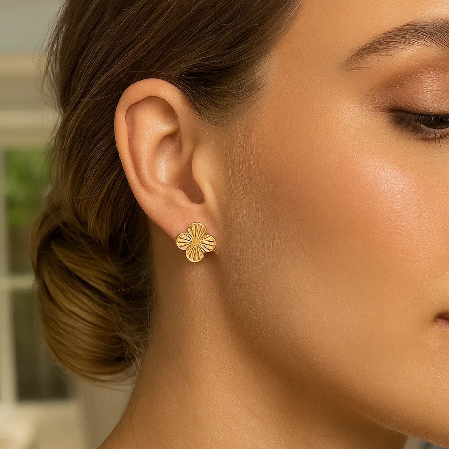 14k yellow gold contemporary clover stud earrings with a polished finish, perfect for elegant everyday wear.