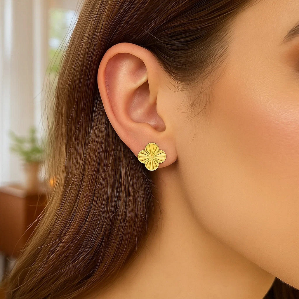 Contemporary 14k yellow gold clover stud earrings with elegant design, perfect for any luxury jewelry collection.