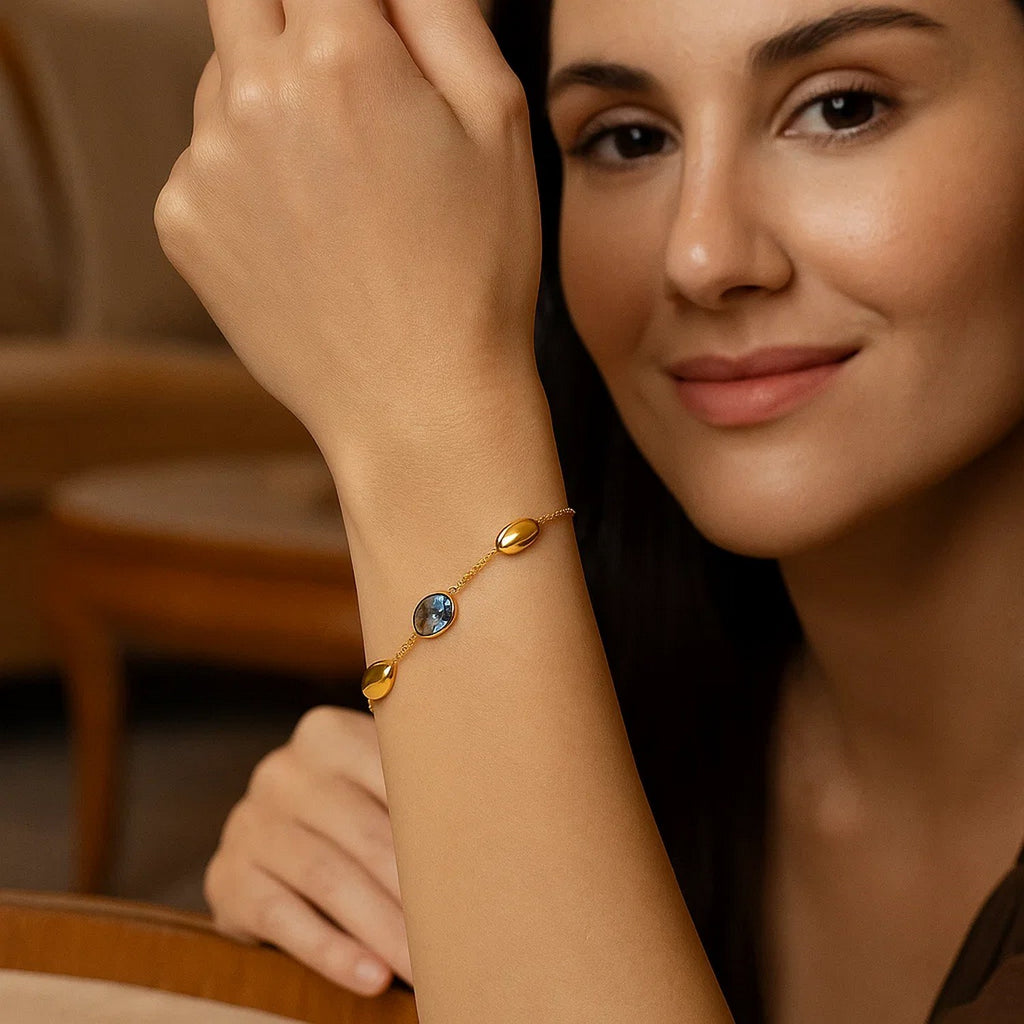 14k yellow gold modern bracelet featuring oval gemstones and elegant bead accents for a luxurious touch.