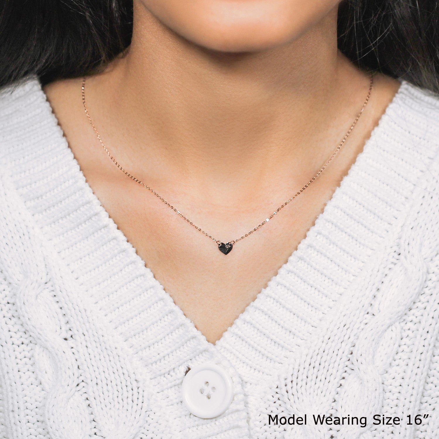 14k rose gold polished mini heart necklace with a delicate chain, embodying timeless elegance and classic charm.