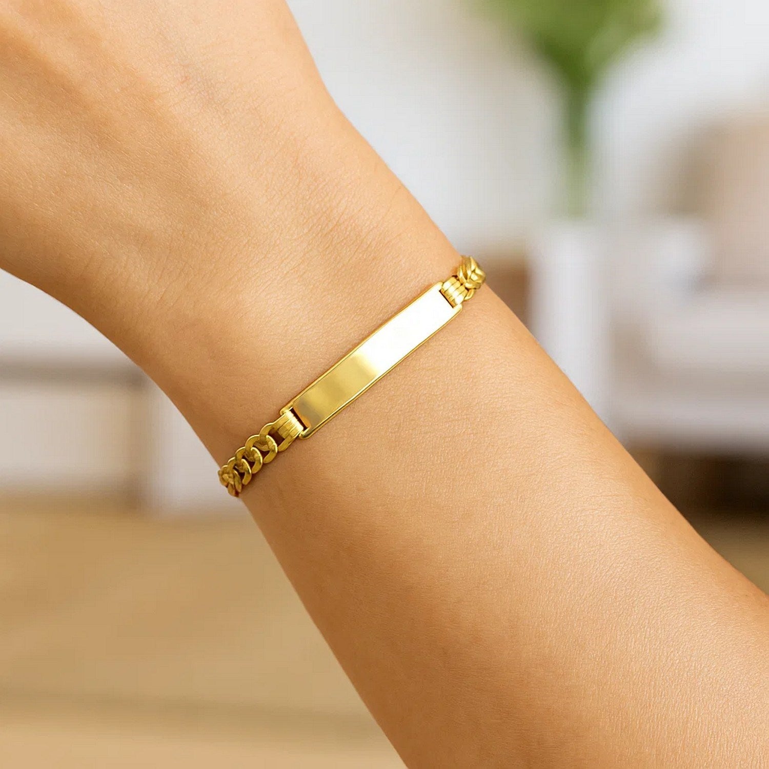 14k yellow gold curb ID bracelet with a modern chain design, showcasing elegance and luxury in every detail.