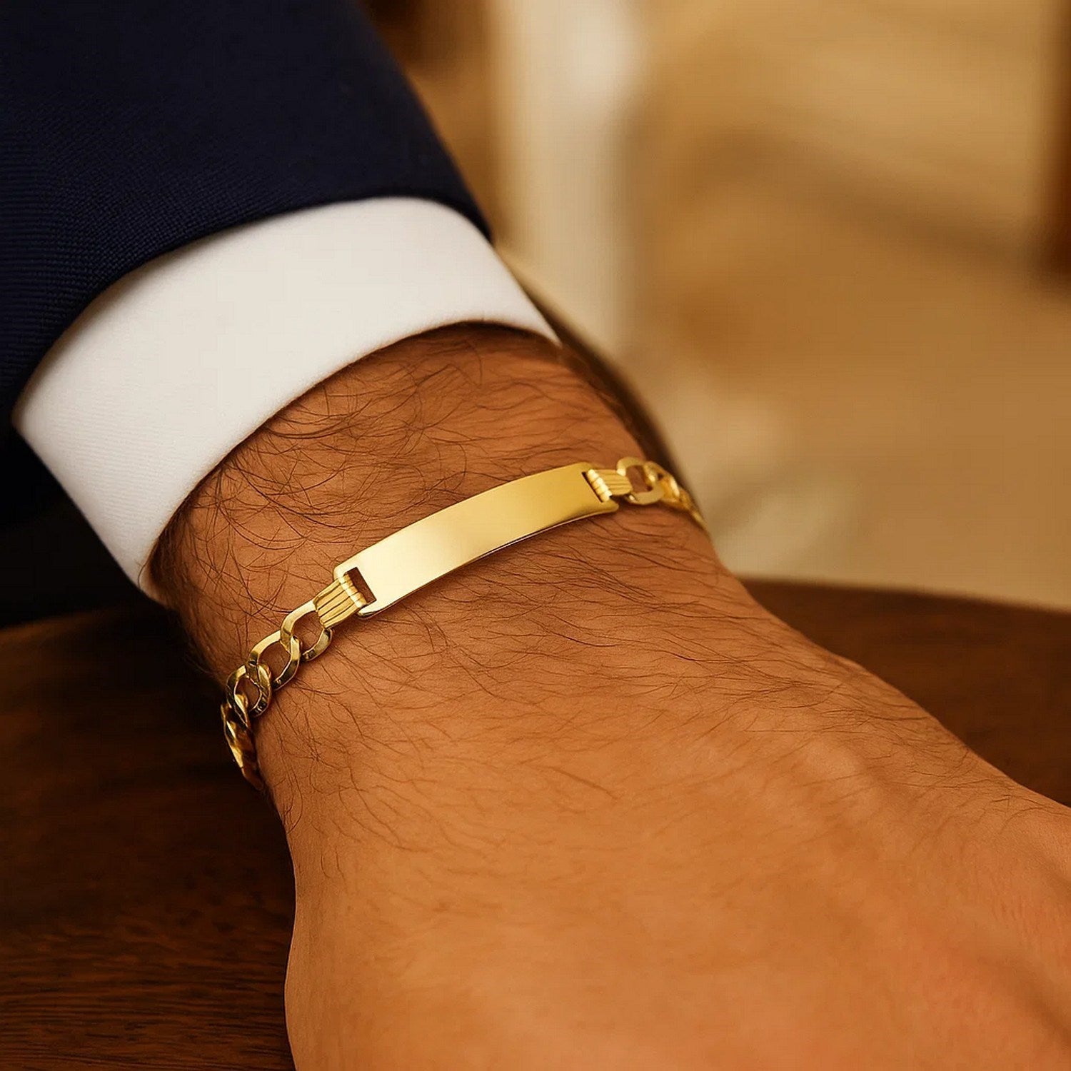 14k yellow gold curb ID bracelet with modern chain design, showcasing elegance and luxury in every detail.