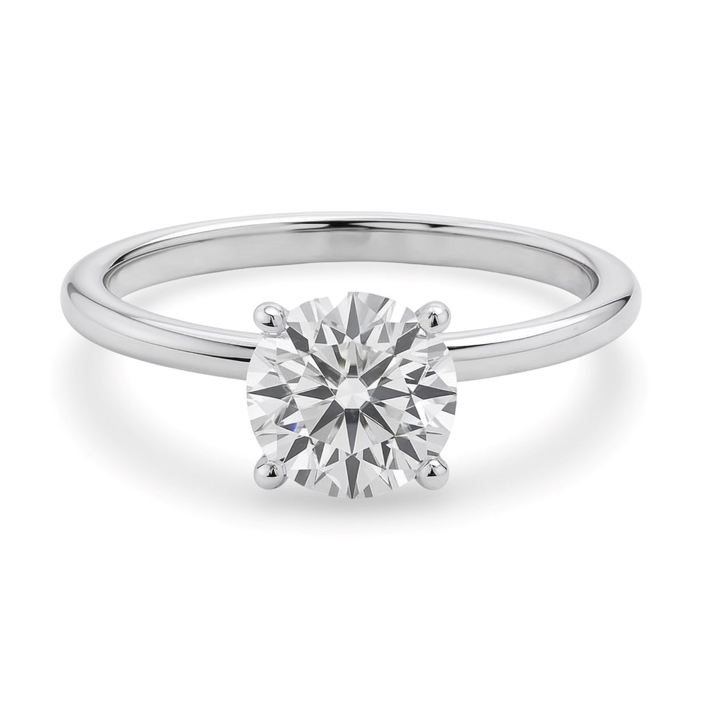 1 1/2 carat round lab-grown diamond ring in elegant 10K white gold, showcasing a timeless solitaire design.