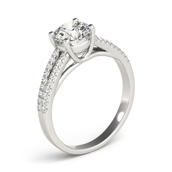 Elegant 14k white gold split shank engagement ring featuring a round diamond, totaling 1 1/8 cttw.