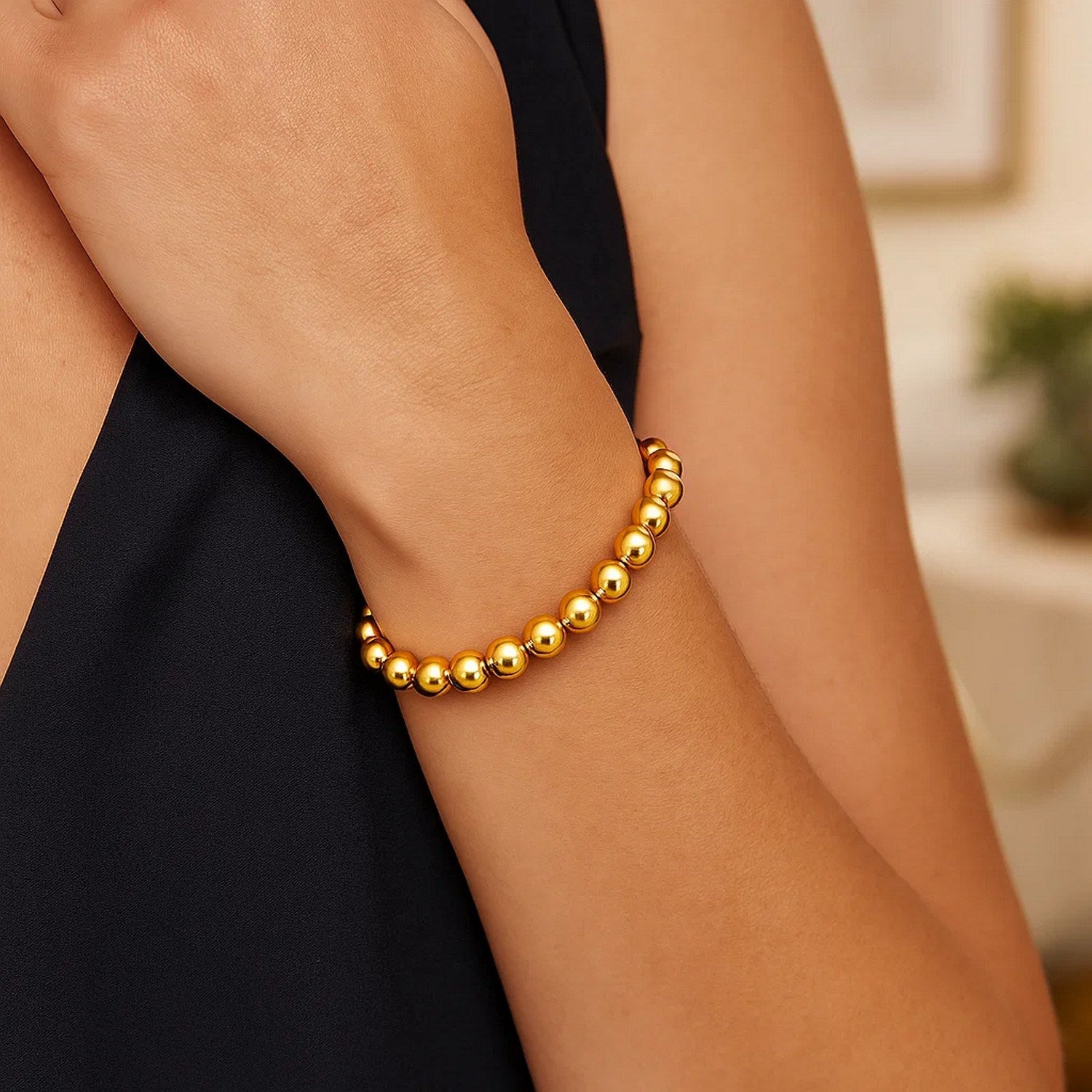 Polished 14k yellow gold 8mm bead bracelet, showcasing an elegant and luxurious design for refined style.