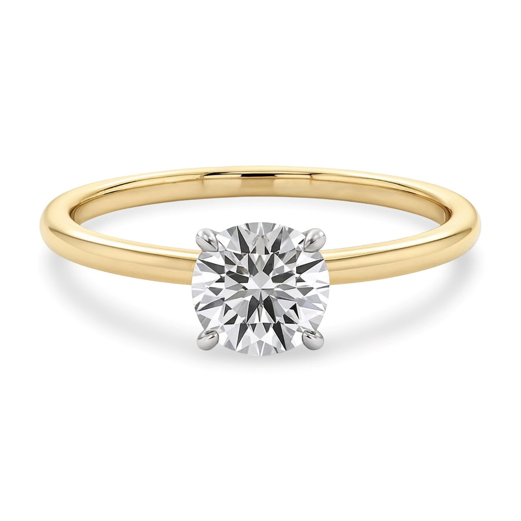 Elegant 14k yellow gold solitaire ring featuring a 3/4 carat round lab-grown diamond, showcasing timeless luxury.