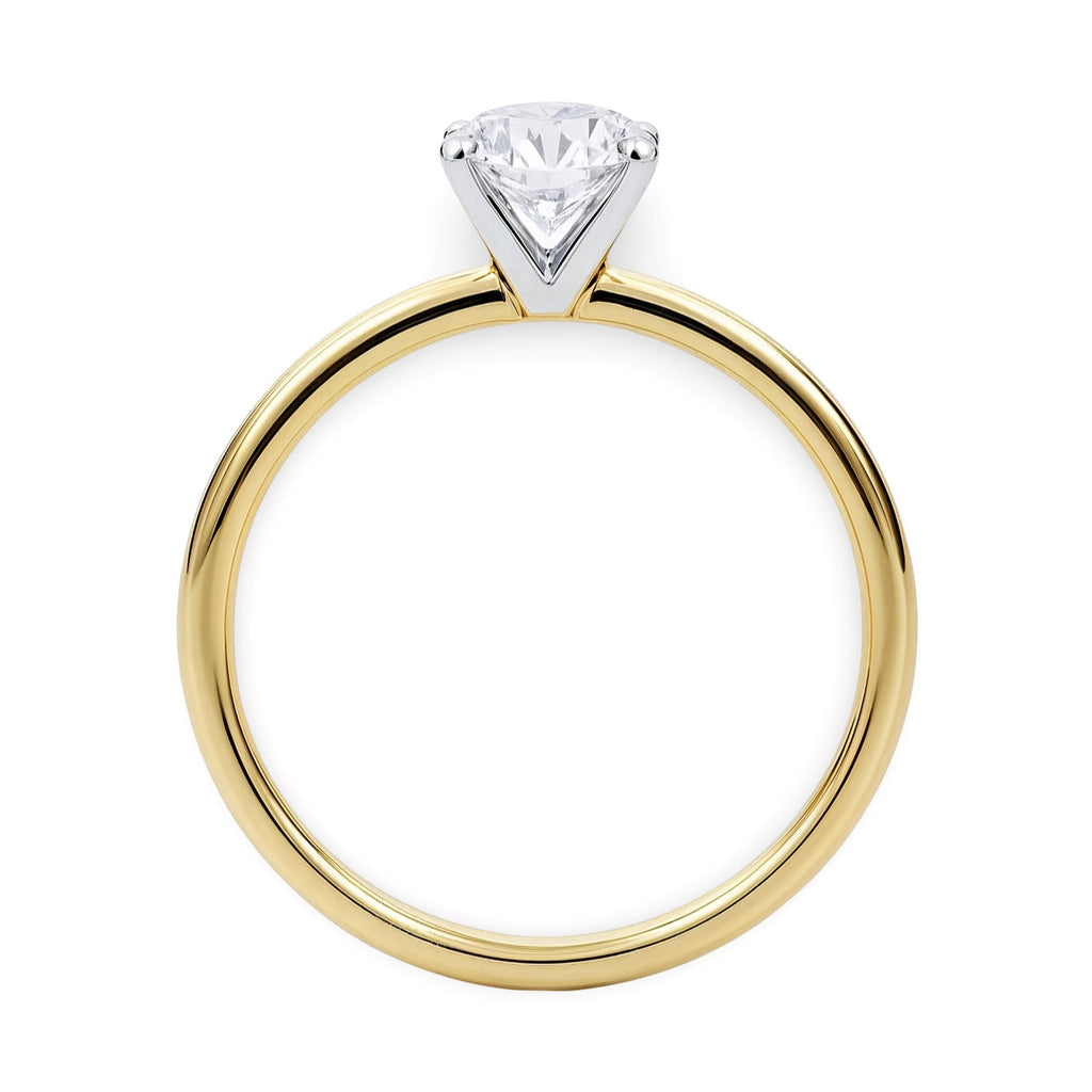 Elegant 14k yellow gold solitaire ring featuring a 3/4 carat round lab-grown diamond, showcasing timeless luxury.