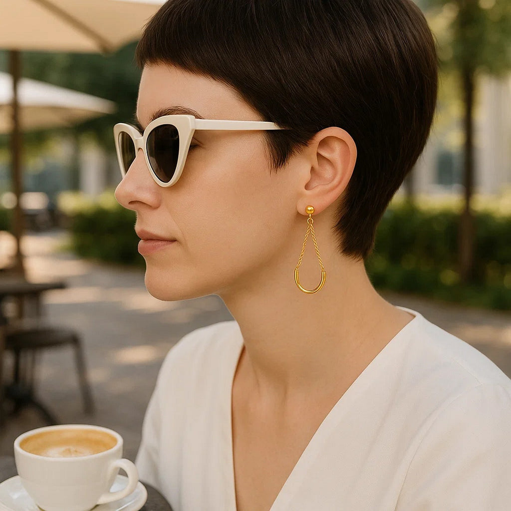 14k yellow gold modern drop earrings featuring elegant curved chain design for a luxurious touch.