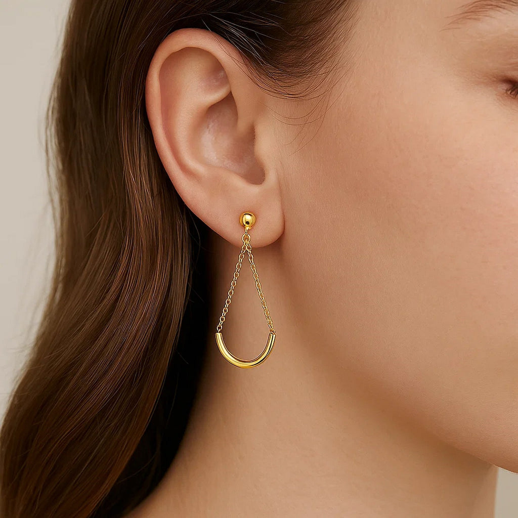 14k yellow gold modern drop earrings featuring elegant curved chain design for a sophisticated look.