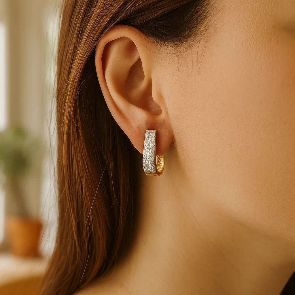 14k two-tone gold textured oval earrings featuring exquisite diamond cuts for a contemporary, luxurious look.