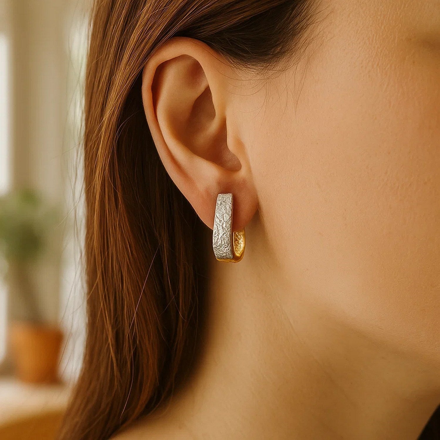 14k two-tone gold textured oval earrings featuring exquisite diamond cuts for a contemporary, luxurious look.