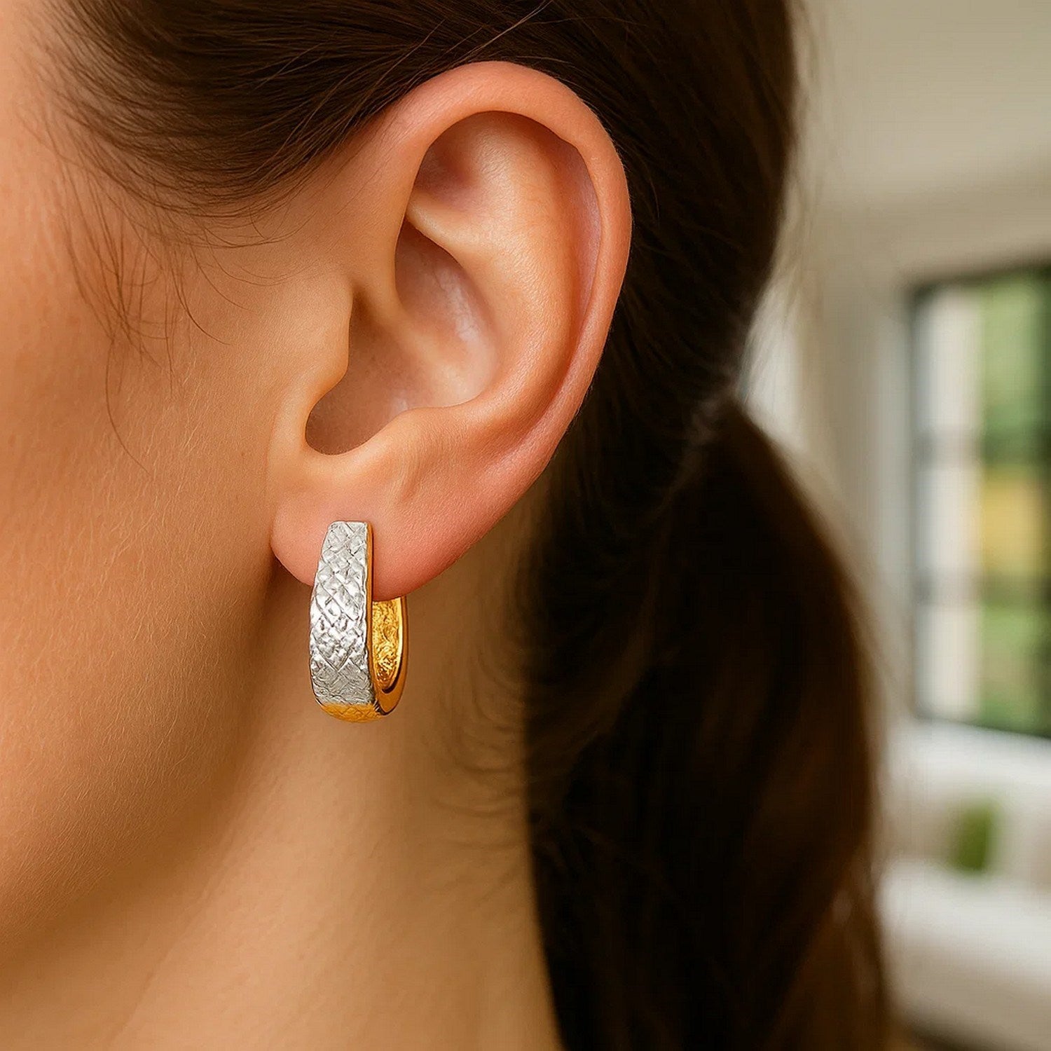 14k two-tone gold textured oval earrings featuring exquisite diamond cuts for a contemporary luxury look.