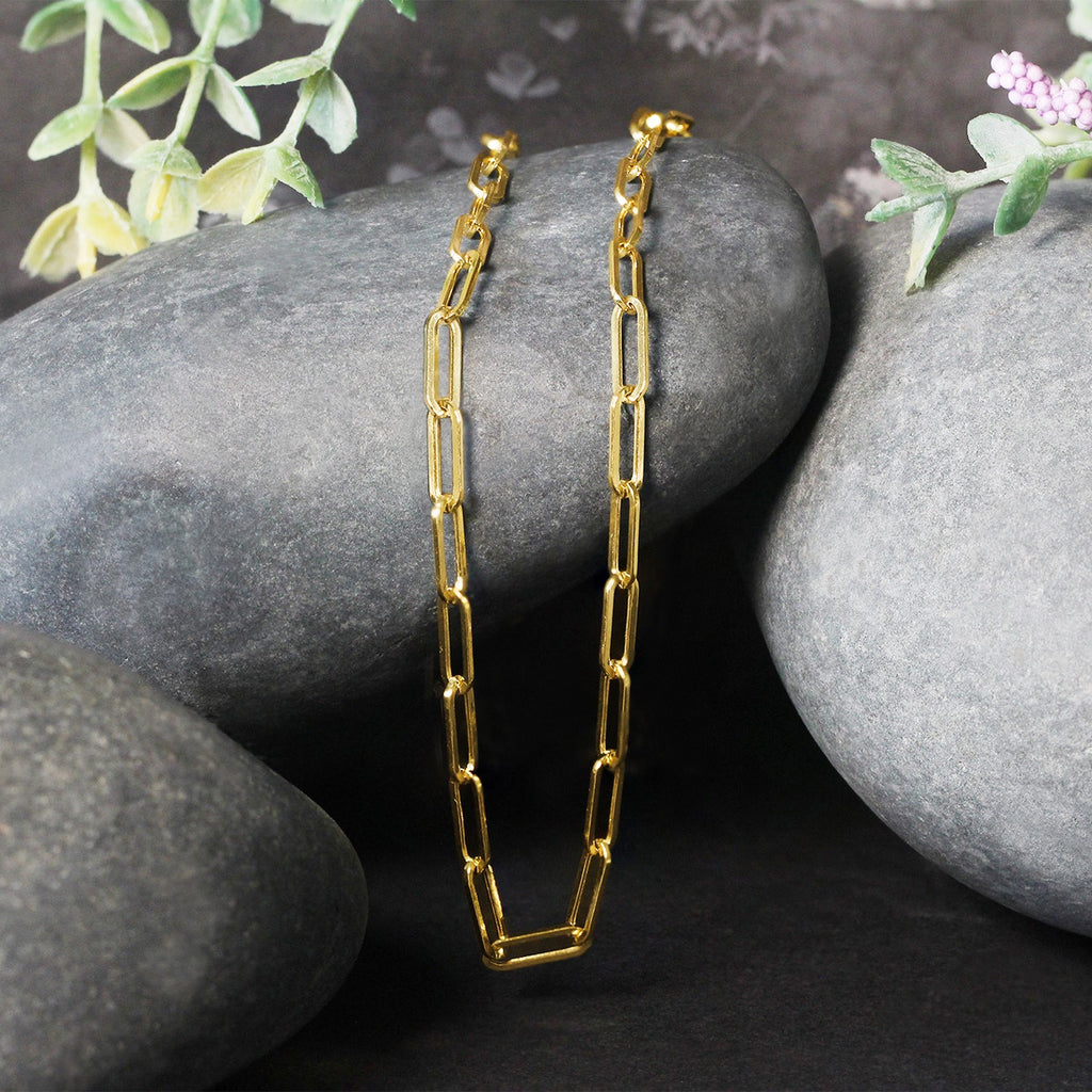 14k yellow gold wide paperclip chain featuring modern links, perfect for layering or wearing solo.